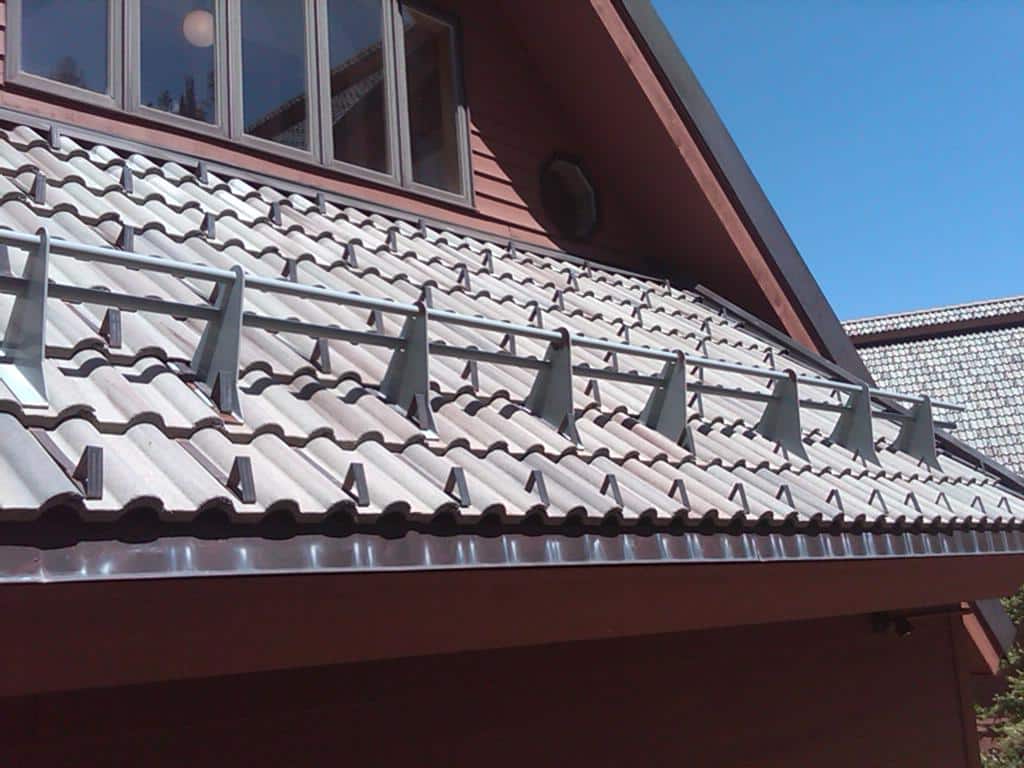 snow guards and snow fence on roof